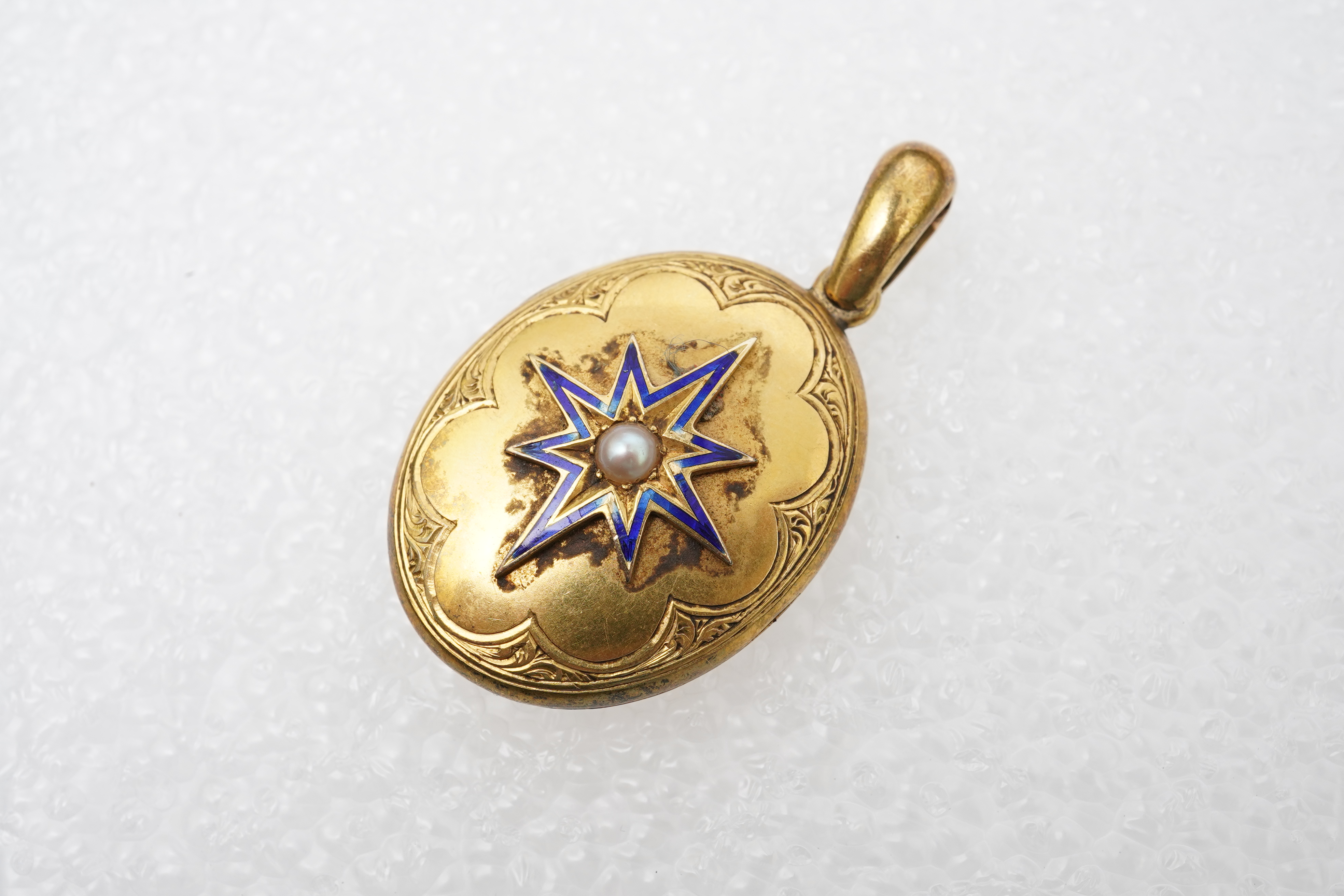 A Victorian enamel and pearl locket, late 19th century